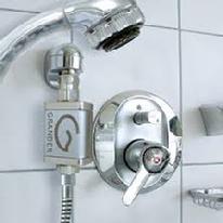 Grander Technologies ® Flexable Water unit attached to shower